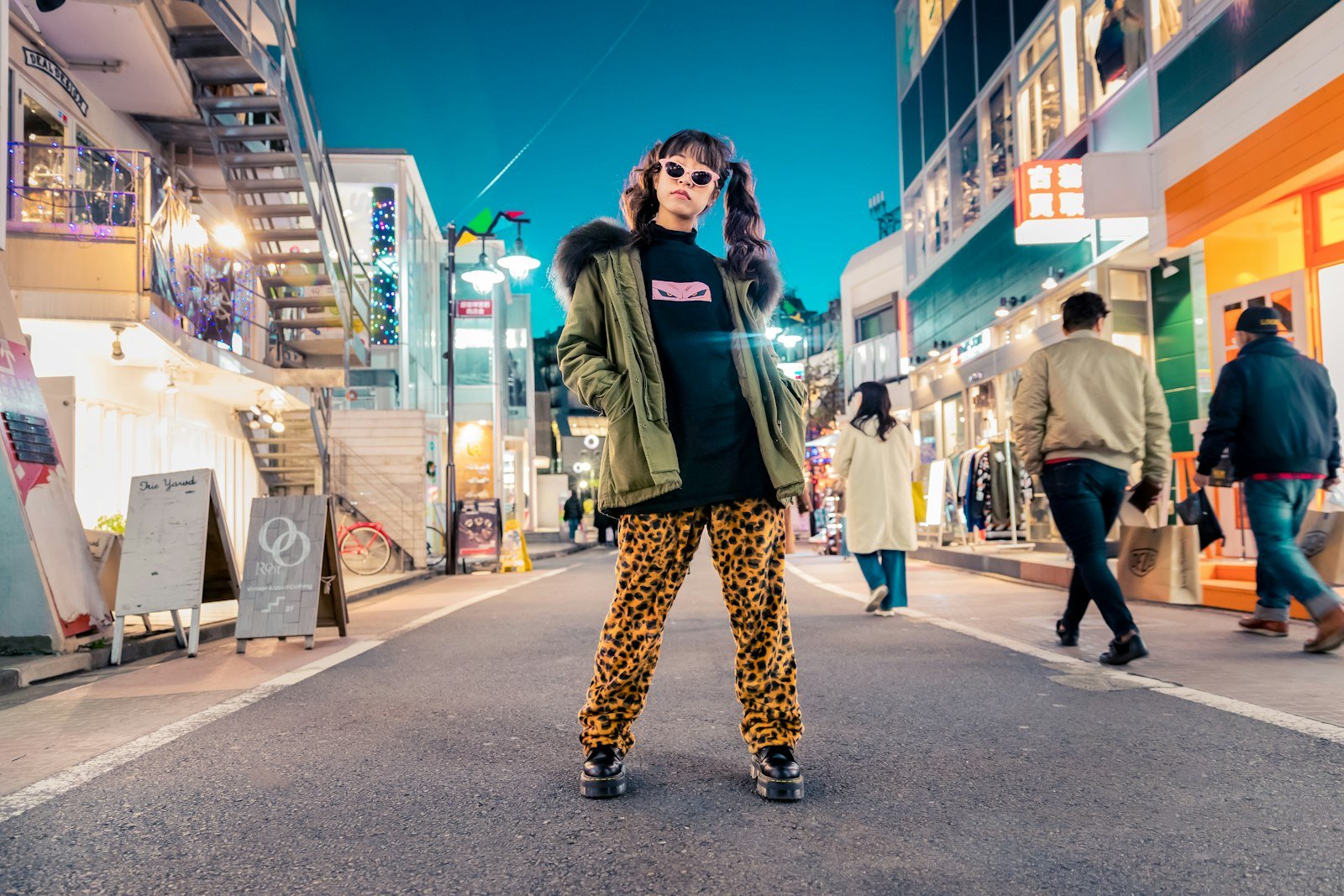 Woman in a statement jacket on the street showing elevated outerwear