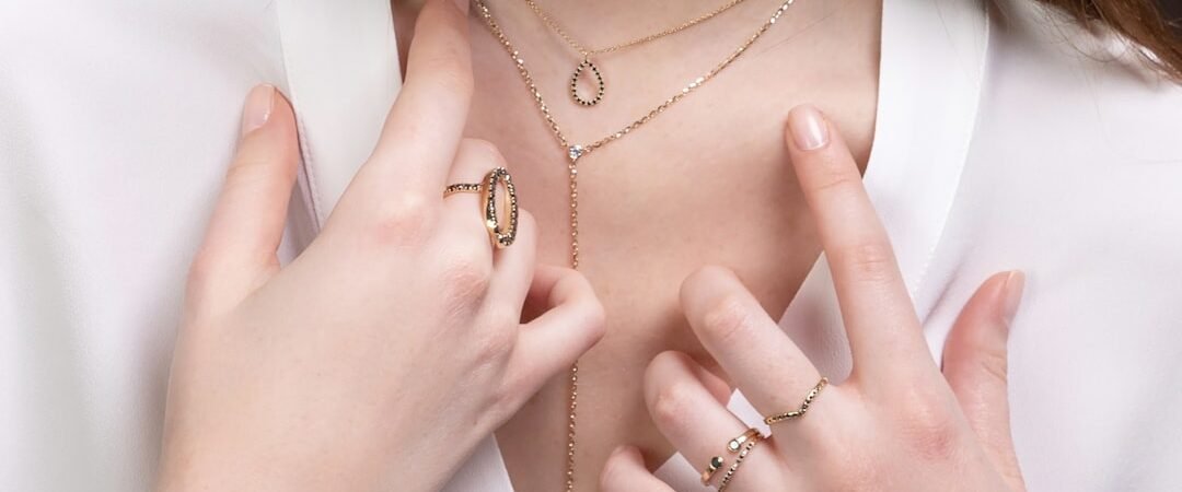 Gold jewelry layering guide: necklaces, rings, and bracelets done right