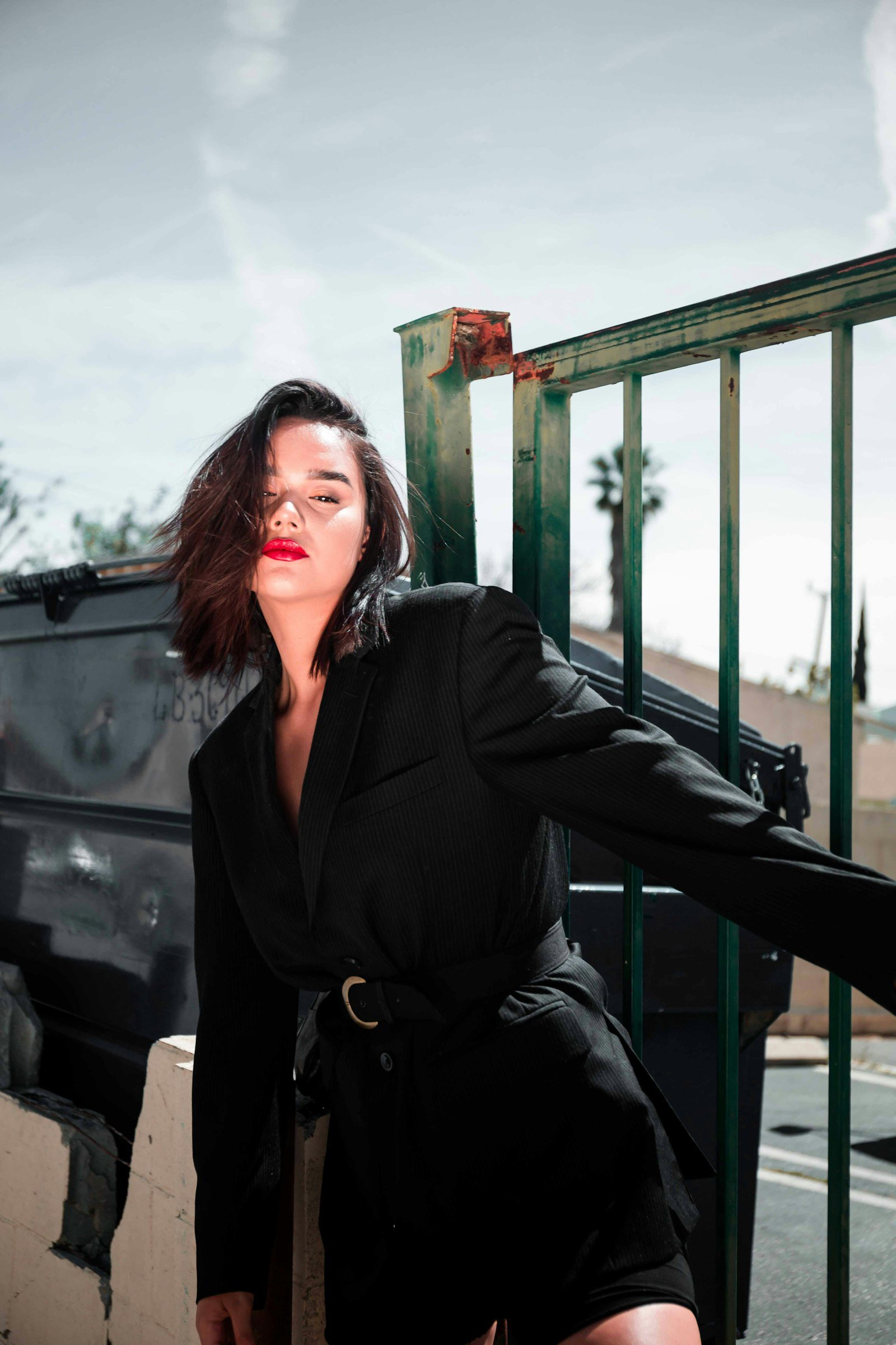 Woman wearing a tailored black blazer showing sharp modern chic tailoring
